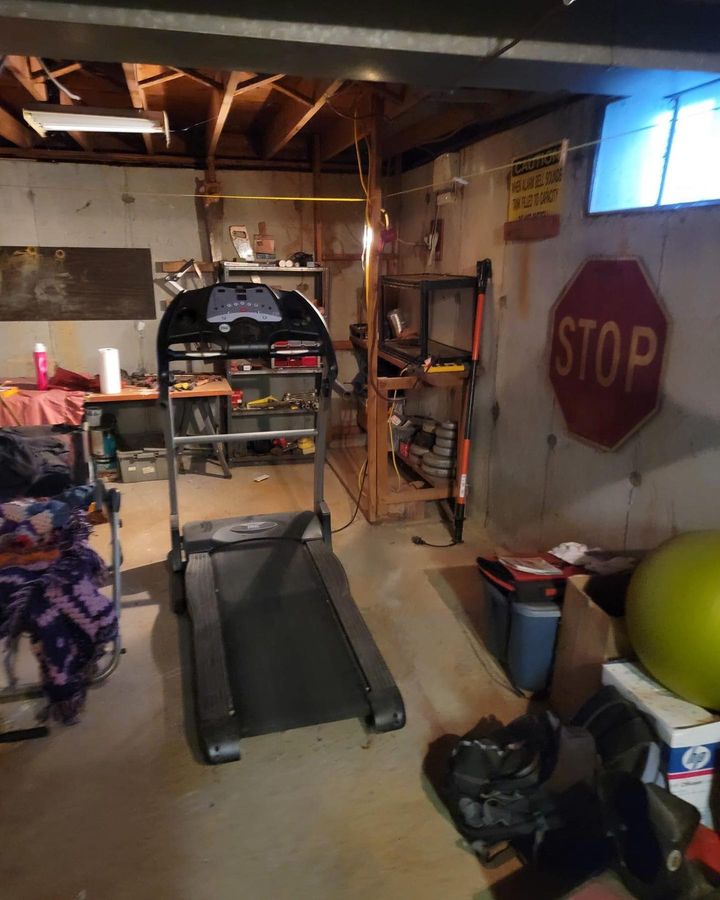 image of a cluttered basement before junk heroes